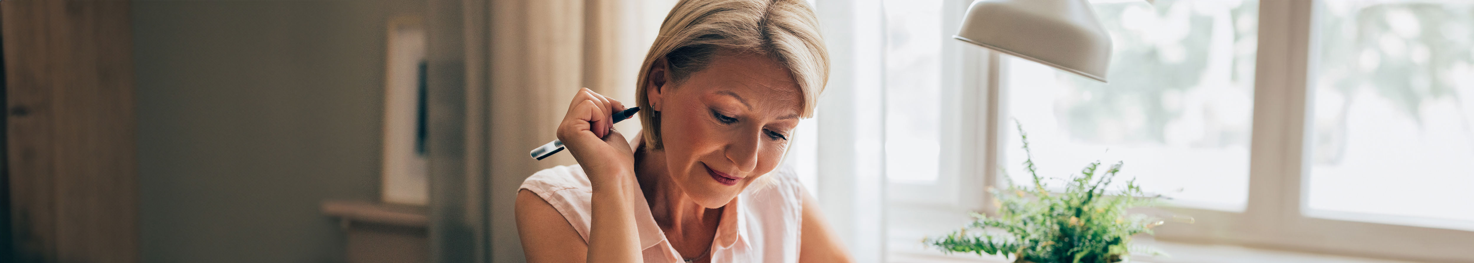 woman with pen prior to breast screen appointment